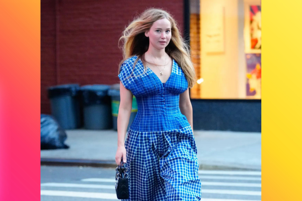 Jennifer Lawrence in a blue dress walking on a street